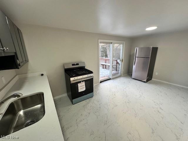 kitchen with appliances with stainless steel finishes and sink