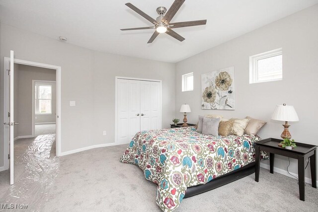 bedroom featuring carpet, ceiling fan, and a closet