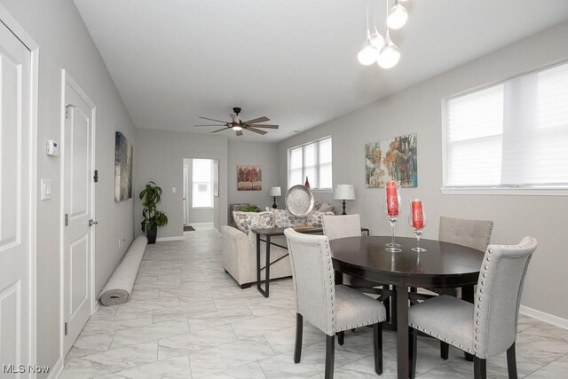 dining space with ceiling fan