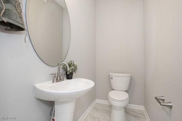 bathroom with toilet and sink