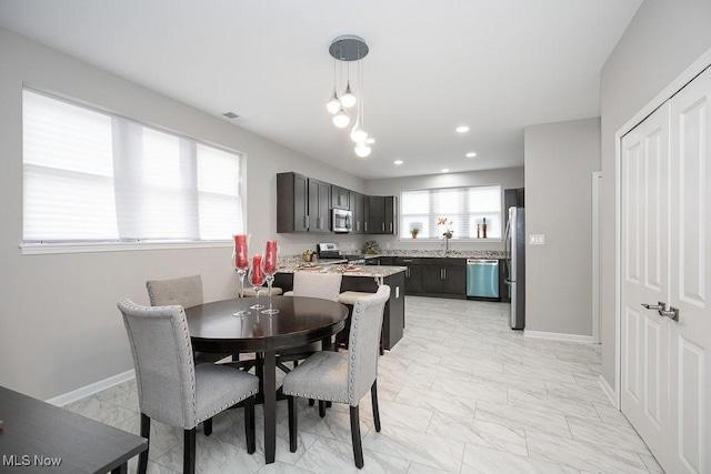 dining area featuring sink