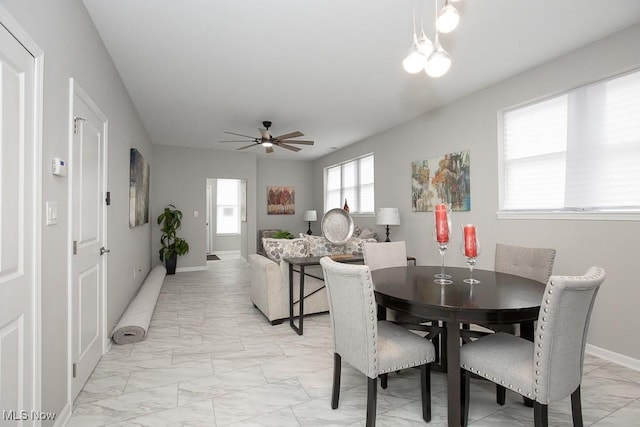 dining space featuring ceiling fan