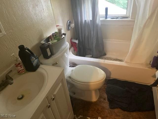 full bathroom with shower / bath combination with curtain, vanity, and toilet