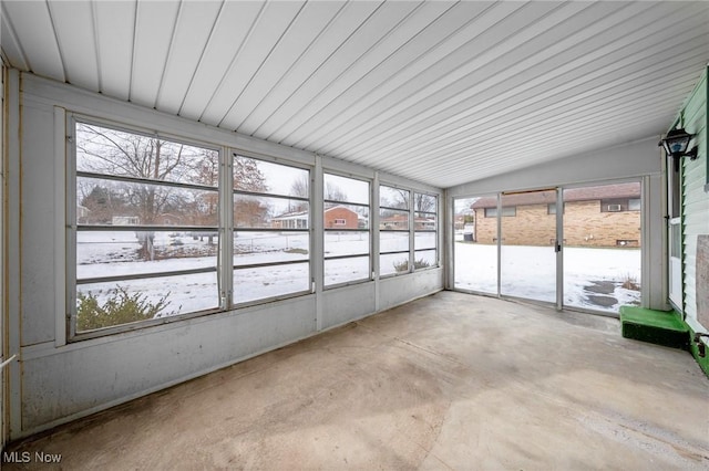 unfurnished sunroom with lofted ceiling