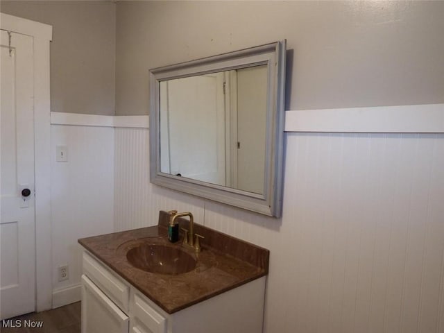 bathroom featuring vanity and wood-type flooring