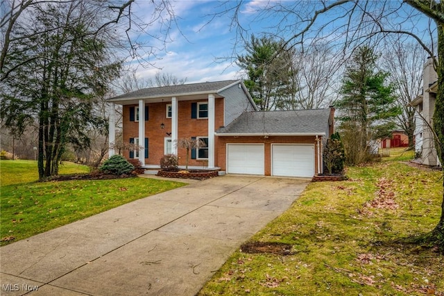 greek revival house with a garage and a front lawn