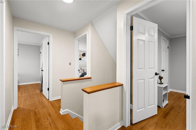 hallway with light hardwood / wood-style flooring