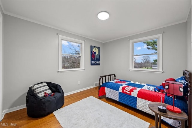 bedroom featuring ornamental molding and wood-type flooring