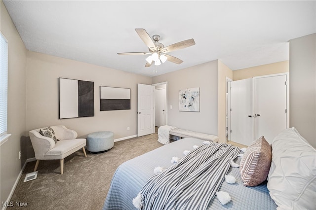 carpeted bedroom with ceiling fan