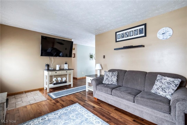 24886 Sherman St, Homeworth, OH 44634 - living room with baseboards, a textured ceiling, and wood finished floors
