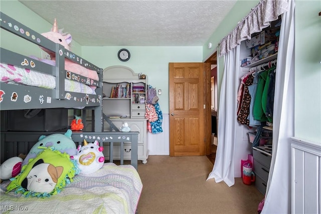 24886 Sherman St, Homeworth, OH 44634 - carpeted bedroom featuring a closet and a textured ceiling