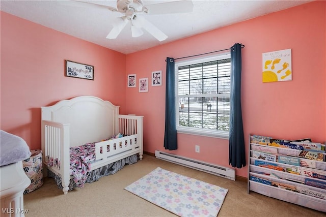 24886 Sherman St, Homeworth, OH 44634 - bedroom featuring carpet floors, a baseboard radiator, and a ceiling fan