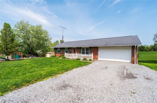 24886 Sherman St, Homeworth, OH 44634 - single story home with brick siding, a garage, a front lawn, and gravel driveway