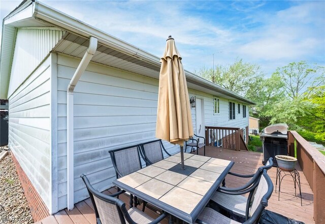 24886 Sherman St, Homeworth, OH 44634 - wooden deck featuring outdoor dining space