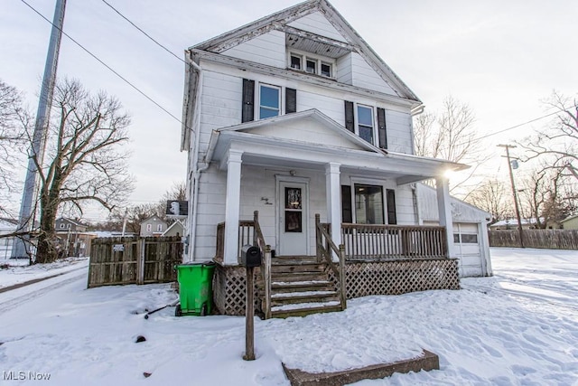 view of front facade featuring a garage and covered porch