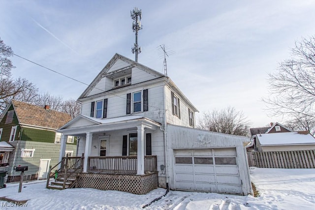 view of front of property with a garage and a porch