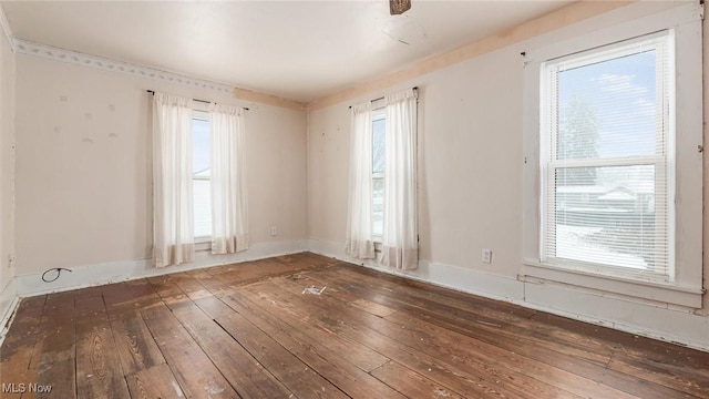 empty room featuring dark hardwood / wood-style flooring