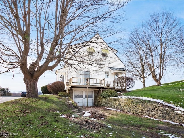 view of property exterior with a wooden deck and a lawn