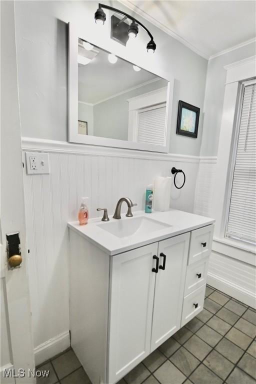 bathroom with vanity, tile patterned floors, and ornamental molding