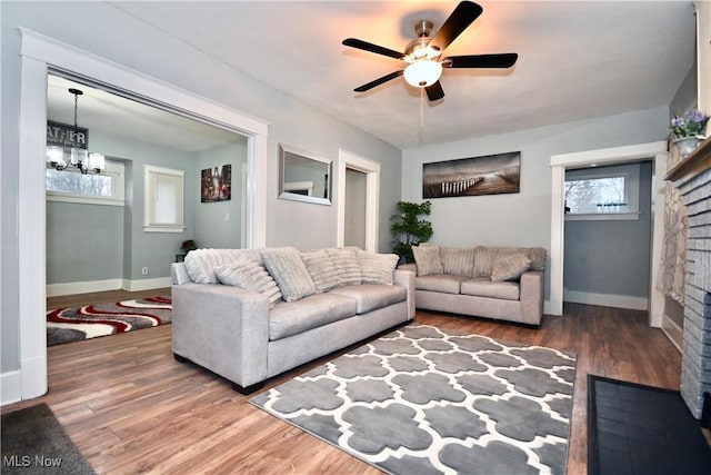 living room with ceiling fan and wood-type flooring