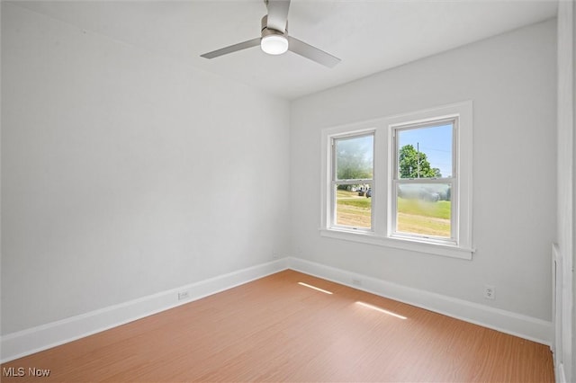 empty room featuring wood-type flooring and ceiling fan