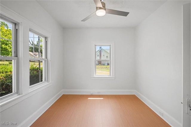 empty room featuring hardwood / wood-style flooring and ceiling fan