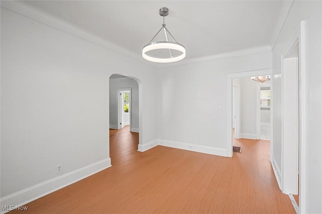 unfurnished room featuring hardwood / wood-style flooring