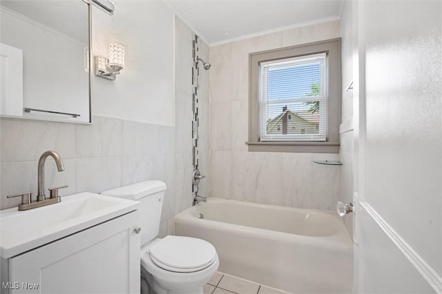 full bathroom featuring tile walls, tiled shower / bath combo, vanity, toilet, and crown molding