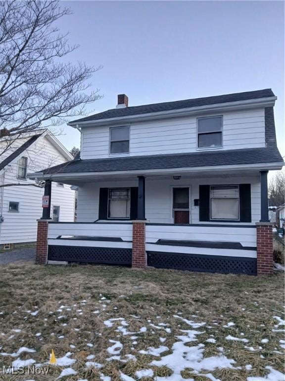 view of property with covered porch