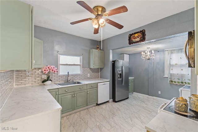 kitchen with sink, stainless steel fridge with ice dispenser, dishwasher, green cabinets, and decorative backsplash