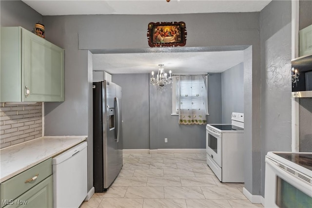 kitchen featuring green cabinets, appliances with stainless steel finishes, backsplash, a notable chandelier, and decorative light fixtures