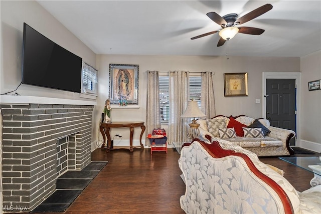 living room with dark wood-type flooring and ceiling fan