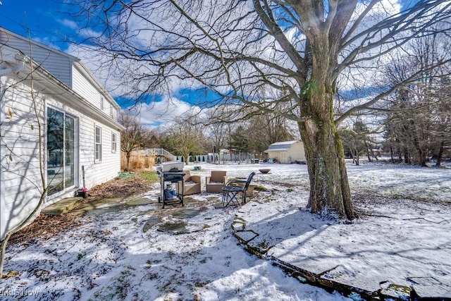 view of yard layered in snow