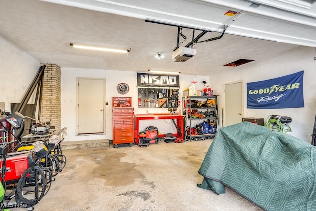 garage featuring a garage door opener