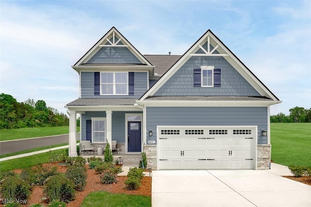 craftsman-style house with a garage, a front yard, and a porch