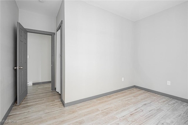 spare room featuring light wood-type flooring