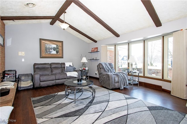 living room with vaulted ceiling with beams, wood finished floors, visible vents, and baseboards