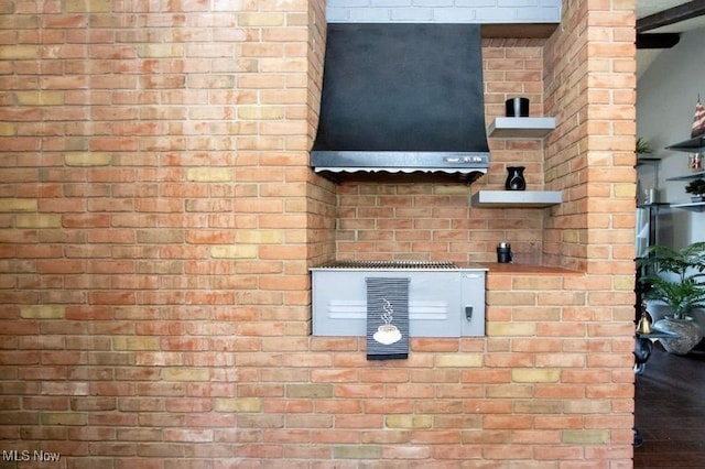 exterior details with brick siding and range hood