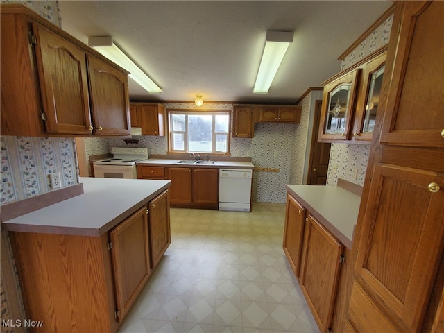 kitchen featuring sink and white appliances