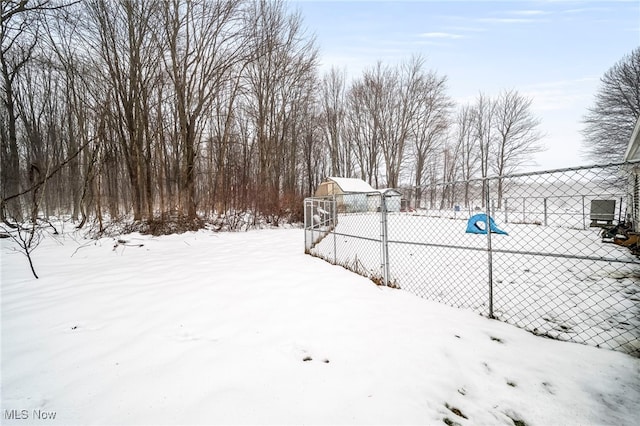 view of yard layered in snow