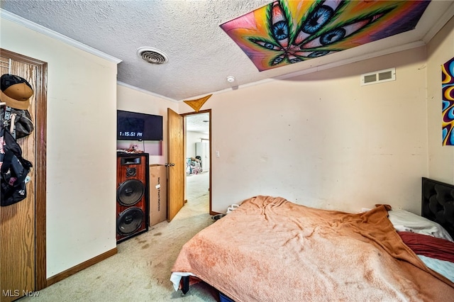 carpeted bedroom with crown molding and a textured ceiling