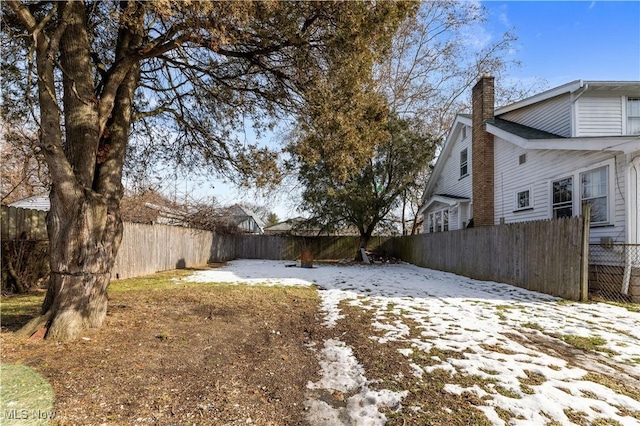 view of yard covered in snow