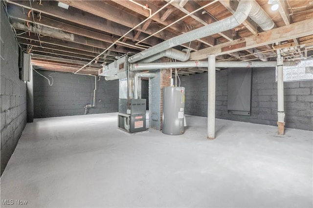 basement featuring heating unit and water heater