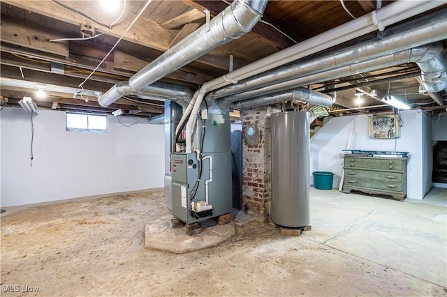 basement featuring heating unit and water heater