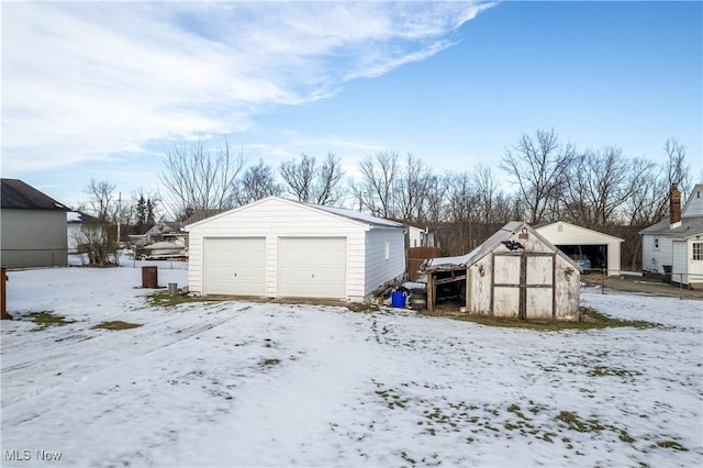 view of snow covered garage