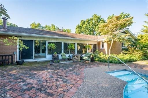 rear view of house with a patio area