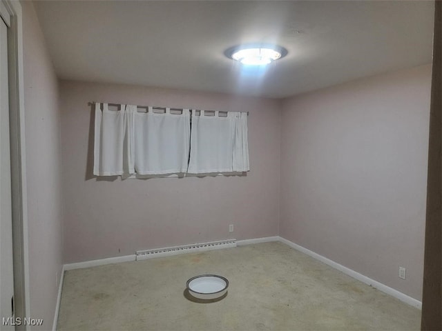 empty room featuring a baseboard radiator