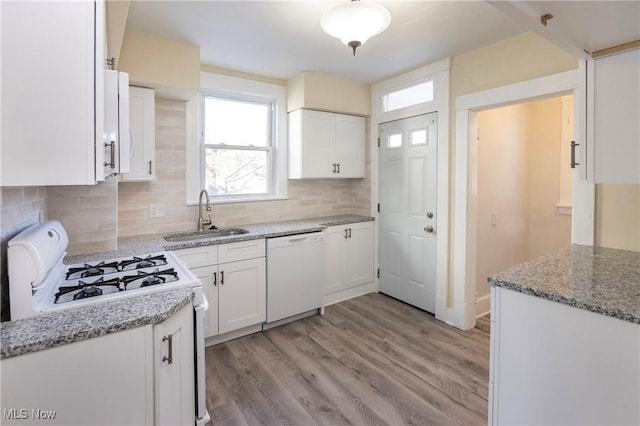 kitchen featuring sink, white appliances, white cabinets, and light wood-type flooring