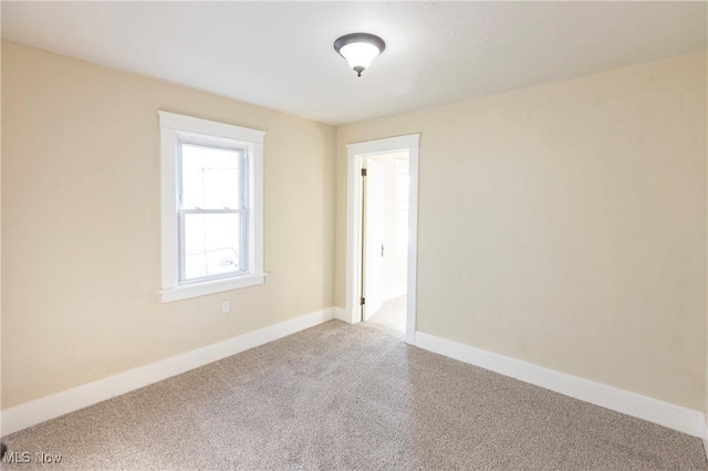 unfurnished room featuring carpet floors