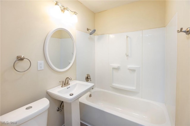 bathroom with toilet and tub / shower combination